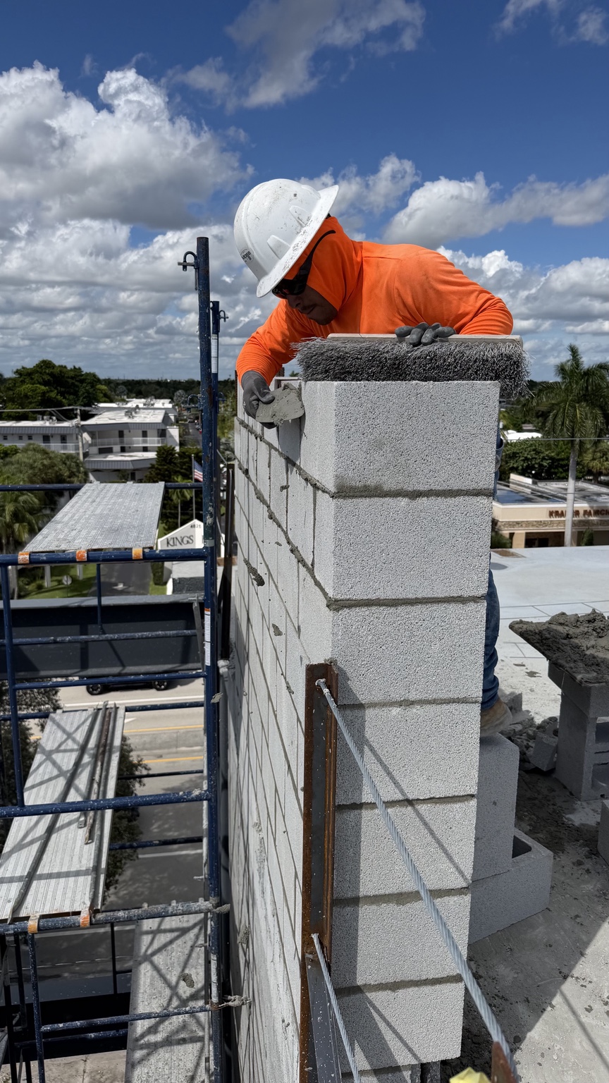 BSG crew member working on CMU masonry at the Fort Lauderdale sports complex