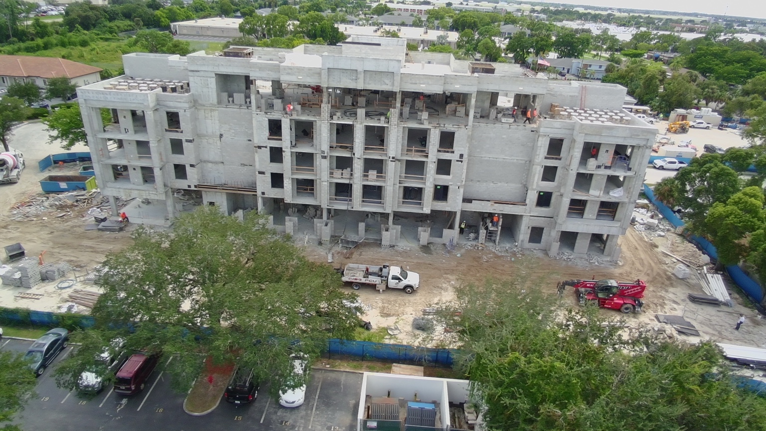 Aerial view of the five-story residential building in Fort Myers showing the CMU block work