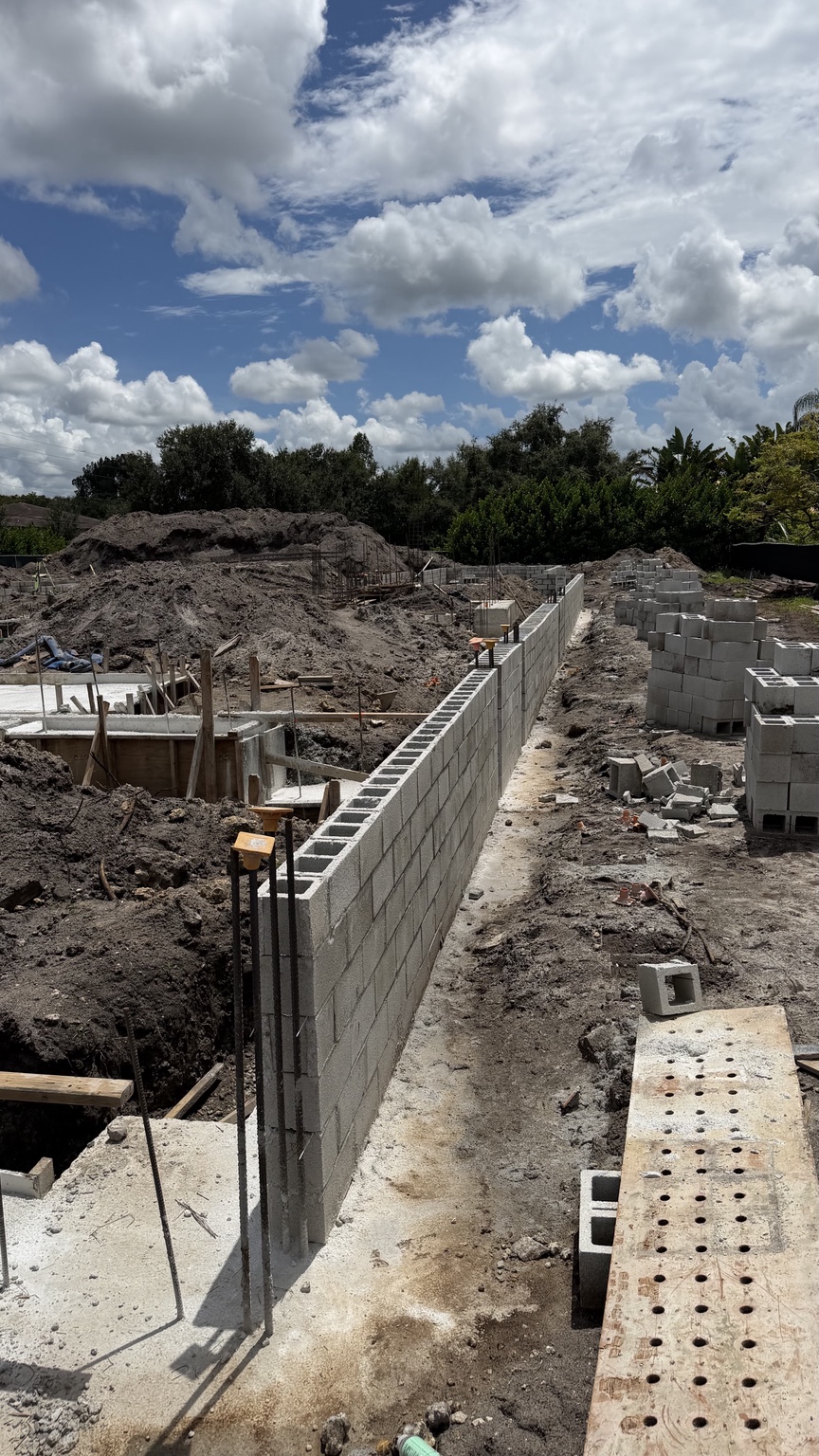 Long masonry wall at the Plantation project